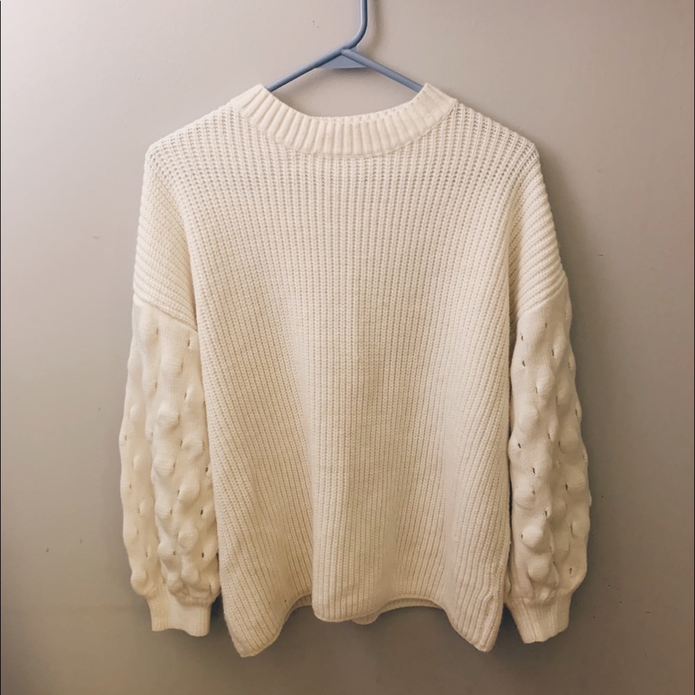 White puffy bell sleeve sweater